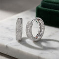 Lightweight silver hoop earrings with secure hinged closure